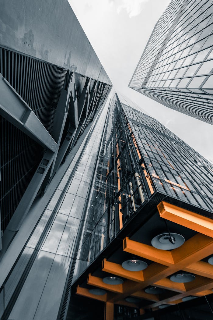Dynamic view of modern skyscrapers in London, highlighting unique design and perspective.